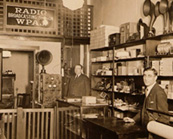 F.M. Doolittle and Italo Martino in WPAJ Storefront circa 1923