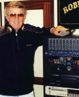 Dick Robinson aboard his yacht in 2000